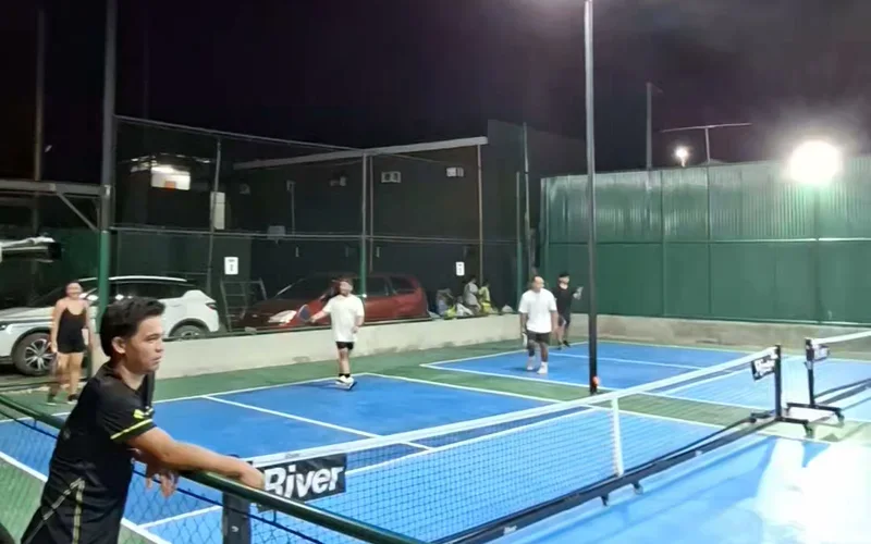 The Netzone outdoor pickleball courts during evening play